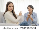 Small photo of Breakup and depressed, quarrel asian young couple love fight relationship in trouble, wife face expression upset with husband, boyfriend want to reconcile, promise his girlfriend. Problem of family.