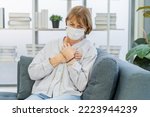 Small photo of Cardiology, angina caucasian mature woman hand hold chest with pain and suffer, having heart attack, hurt sudden coronary symptom arrhythmia, palpitation. Health care, heart disease of senior older.