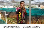 Small photo of Residents provide feed for catfish in the Al-Ikhlas Mosque area, Neglasari, Tangerang City, Friday (27-8-2021). IDR 400 per head depending on the size.