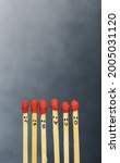 Small photo of Group of a red match burning isolated with the background. Row burning matchstick in the chain reaction. Matchstick art photography.