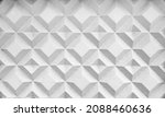 Small photo of Background texture of square 3d white tiles on facade. Street stone cement wall with geometric rhombus pattern, concrete light gray polygons. Building cladding, architectural masonry