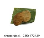 Small photo of Fried tubers on banana leaves, crispy tubers, Indonesian snacks or side dishes, fried tubers, fried sweet potatoes, isolated.