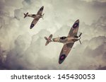 Vintage style colored artwork of a Battle of Britain era, British RAF Spitfire fighter at high altitude. This aircraft became famous during the summer of 1940 - Artist