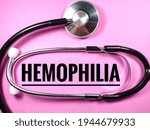 Small photo of Blur word HEMOPHILIA on pink background with blur stethoscope.Medical concept.