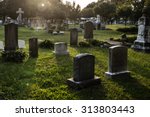 Tombstones in cemetery at dusk