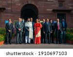 Small photo of New Delhi, India-1 February 2021Union Finance Minister Nirmala Sitharaman , MoS Finance Anurag Thakur with budget team shows iPad enveloped in red cover with a golden National emblem on it.