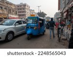 Small photo of Old Delhi, India-Jan 6, 2023: Electric Auto Rickshaw on road at Darya Ganj in old Delhi area.