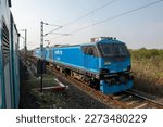 Small photo of Narkhed, Maharashtra, India, Jan 20 2023: WAG 12 B electric engine pulling goods wagon, Made in India electric locomotive or e-loco of 12,000 horsepower (HP), india's most powerful electric locomotive