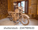 Small photo of Guwahati, Assam, India-Jan 10 2020: A replica of bamboo woven motor bike kept in a room with bamboo decor walls at North East Cane and Bamboo Development Council in Guwahati.