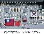 Small photo of Flag of the Republic of China or Taiwan, China, Korea and USA on a processor, CPU or GPU microchip on a motherboard. Taiwan manufacturing chip industry emerges as battlefront in U.S. - China showdown.