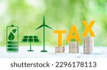 Small photo of Clean, renewable energy or electricity production tax credits and incentives, financial concept : Green energy symbols e.g solar panel, wind turbine, fuel cell battery and the word TAX atop con stack.
