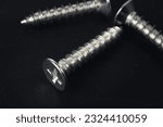 Close-up of self-tapping screw. Crosshead screw slot