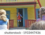 Small photo of Children watching Pippi Longstocking performance at Astrid Lindgren's World theme park, Vimmerby, Sweden. Children's entertainment. Summer holiday. Space for copy.