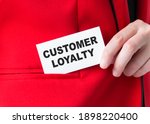 Small photo of Customer loyalty card in businessman hands, which he puts into the korman of the red jacket