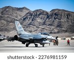Small photo of A U.S. Air Force F-16D Fighting Falcon assigned to the 55th Fighter Squadron receives final checks before taxiing to the runway during the first day of exercise Red Flag-Nellis (RF-N) 23-2 at Nellis A