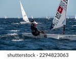 Small photo of Hyeres, France - 23-04-2023: Maud Jayet (SUI) competes in ILCA6 class during the 51th edition of the French Olympic Week in Hyeres, France on April 23, 2023.
