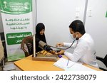 Small photo of HAJJAH, YEMEN – October 17, 2023: Poor and displaced people receive free medical services from a mobile charity medical clinic in Hayran District, Hajjah Governorate, Yemen
