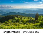 Beautiful summer mountain landscape. Blue sky with  clouds over layers of green hills and  mountains.  Copy space. North Carolina. Blue Ridge Parkway.USA.