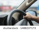 Young male driving behind the wheel.