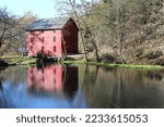 Small photo of EMINENCE, MISSOURI, USA - NOVEMBER 9 2016 Ozark National Scenic Riverways, Alley Spring reflection of Alley Mill in the Mill Pond