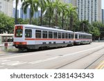 Small photo of Tuen Mun, Hong Kong - August 23, 2023: Hong Kong New Territories Light Rail Transit phase I, II, III on route 610 and 615.