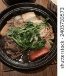 Small photo of New York, USA - 23rd December, 2023: Ootoya has the best Washu Beef Sukiyaki and Salmon Tonyu Nabe Pot in New York City.