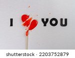 I love you inscription with broken heart lollipop. Divorce or broke up concept. I dont love you anymore.