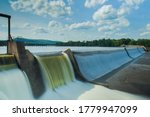 Hydroelectric power energy plant with turbines and water spills for generating green electricity. Free, green adn ecological energy concept. Climate changes