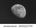 Small photo of A waning moon in the dark sky. Astronomy.