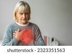 Small photo of Senior adult elderly woman with chest pain suffering from heart attack, health and medical, heart health, heart attack, world heart day, cardiovascular disease.insurance and hospital concept
