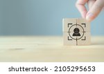 Small photo of Personalized marketing concept. Customer behavior and persona. Customization strategy. Customer centric. Hand put the wooden cubes focused on personalization icon on grey backgroud and copy space.