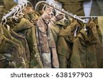Samples camouflage military clothes in the store