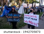 Small photo of Activists and homeless gather near tents housing the homeless at an encampment in Echo Lake Park as the city makes plans to evict all the parks encampments in Los Angeles, March 24, 2021.
