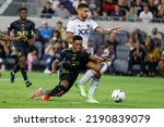 Small photo of Los Angeles FC midfielder Latif Blessing (7) and D.C. United midfielder Victor Palsson (44) vie for the ball during an MLS soccer match Saturday, Aug. 16, 2022, in Los Angeles.