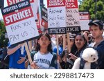 Small photo of Members of the The Writers Guild of America (WGA) picket outside Paramount Pictures on Friday, May 5, 2023, in Los Angeles.