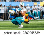Small photo of Miami Dolphins wide receiver River Cracraft (FRONT) is brought down by Los Angeles Chargers safety Derwin James Jr. (BACK) during an NFL football game, Sept. 10, 2023, in Inglewood, Calif.