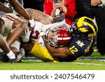 Small photo of Alabama wide receiver Jermaine Burton (L) is brought down by Michigan defensive back Josh Wallace (R) during the 2024 Rose Bowl game Monday, Jan. 1, 2024, in Pasadena, Calif.