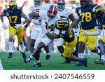 Small photo of Alabama tight end Amari Niblack #84 is brought down by Michigan defensive line Rayshaun Benny #26 during the 2024 Rose Bowl game Monday, Jan. 1, 2024, in Pasadena, Calif.