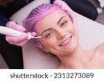 Small photo of closeup photo of woman's face, photo of aesthetics, anti aging procedures. Plasma jet application. Aesthetics, spa. beautician.