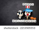 Small photo of Happy Halloween sign with little cute doctor and bozo ghost on black texture background, Hallow ween concept background