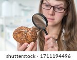 scientist examines a kaiser bun ... | Shutterstock . vector #1711194496