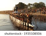 Small photo of BAROTSELAND, WESTERN ZAMBIA - APRIL 12, 2008 Spectators looking on at the Kuomboka ceremony when the king of the Lozi tribe of Barotseland relocates from his summer island palace to his winter palace