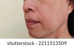 Small photo of portrait showing the flabbiness and wrinkles corner of the mouth, dullness and dark spots on the face, problem Flabby and rough skin, freckles and ages skin of Middle-aged woman, concept health care.