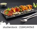 Small photo of Paneer Tikka is popular Indian appetizer made with cubes of paneer and veggies marinated with yogurt and spices
