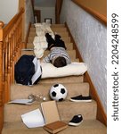 Small photo of A young student is tired and late for school laying on the tpes at his home for a youth sleep deprevation or tardy concept.