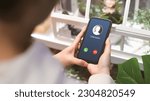 Small photo of Woman holding mobile phone with incoming call from unknown caller. scammer or stranger, Hoax person with fake identity, Prank caller, anonymous, smartphone, Fraud or phishing concept