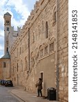 Small photo of Trento, Italy - April 16, 2022: Musician playing the saxophone in front of the Tridentine Diocesan Museum