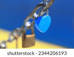Blue heart shaped padlock as...
