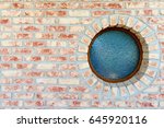 Round Window On Brick Wall