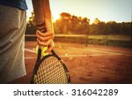Close Up Of Man Holding Tennis...